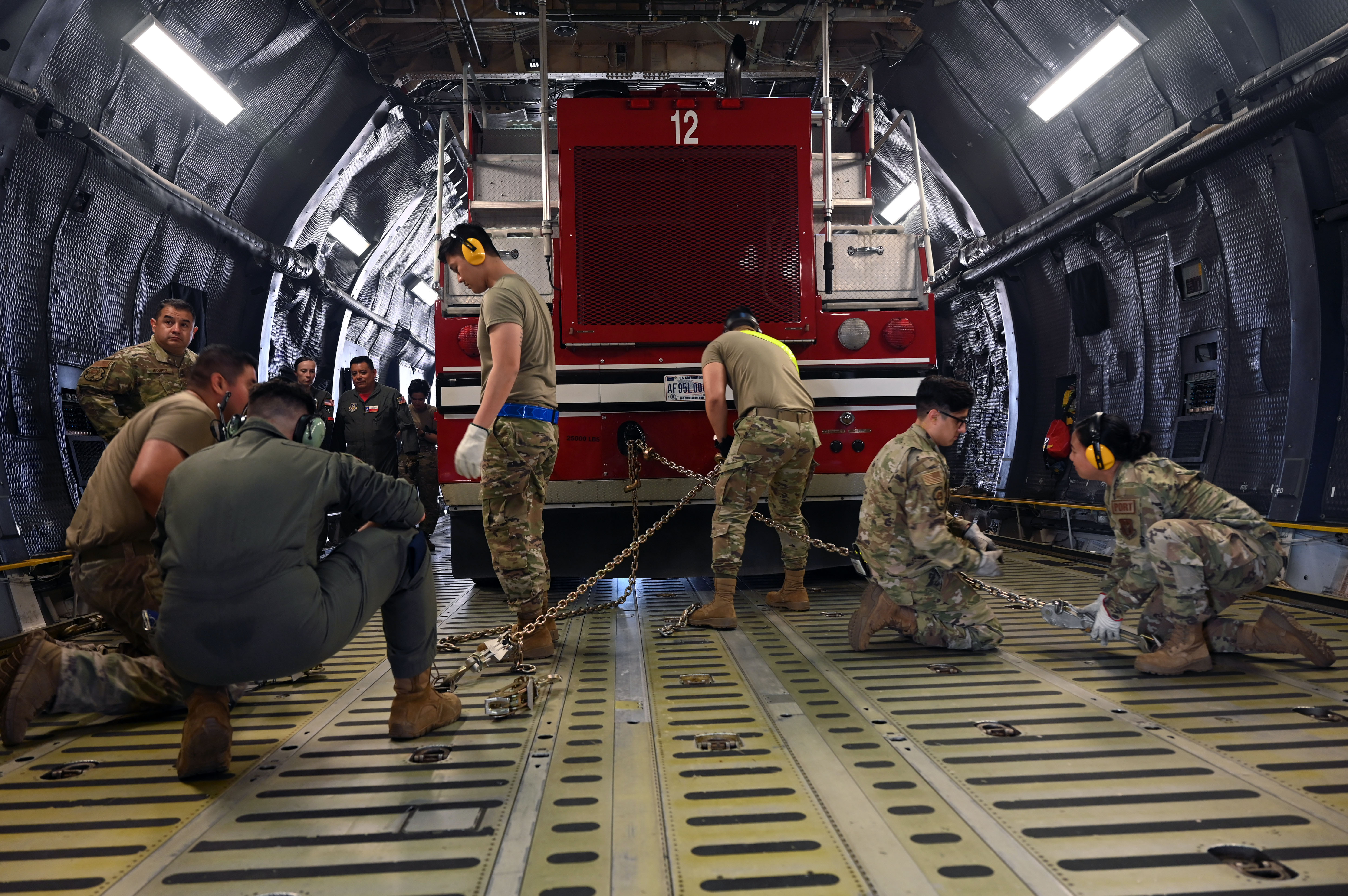 Photo of Aerial Porters securing cargo inside a C-5.