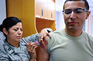 Photo of medic administering an injection.